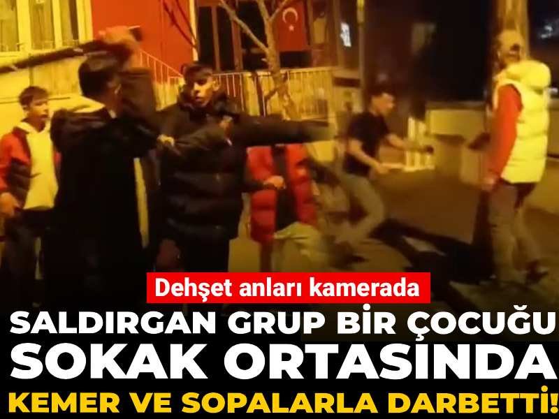 Saldırgan grup bir çocuğu sokak ortasında kemer ve sopalarla darbetti! Dehşet anları kamerada